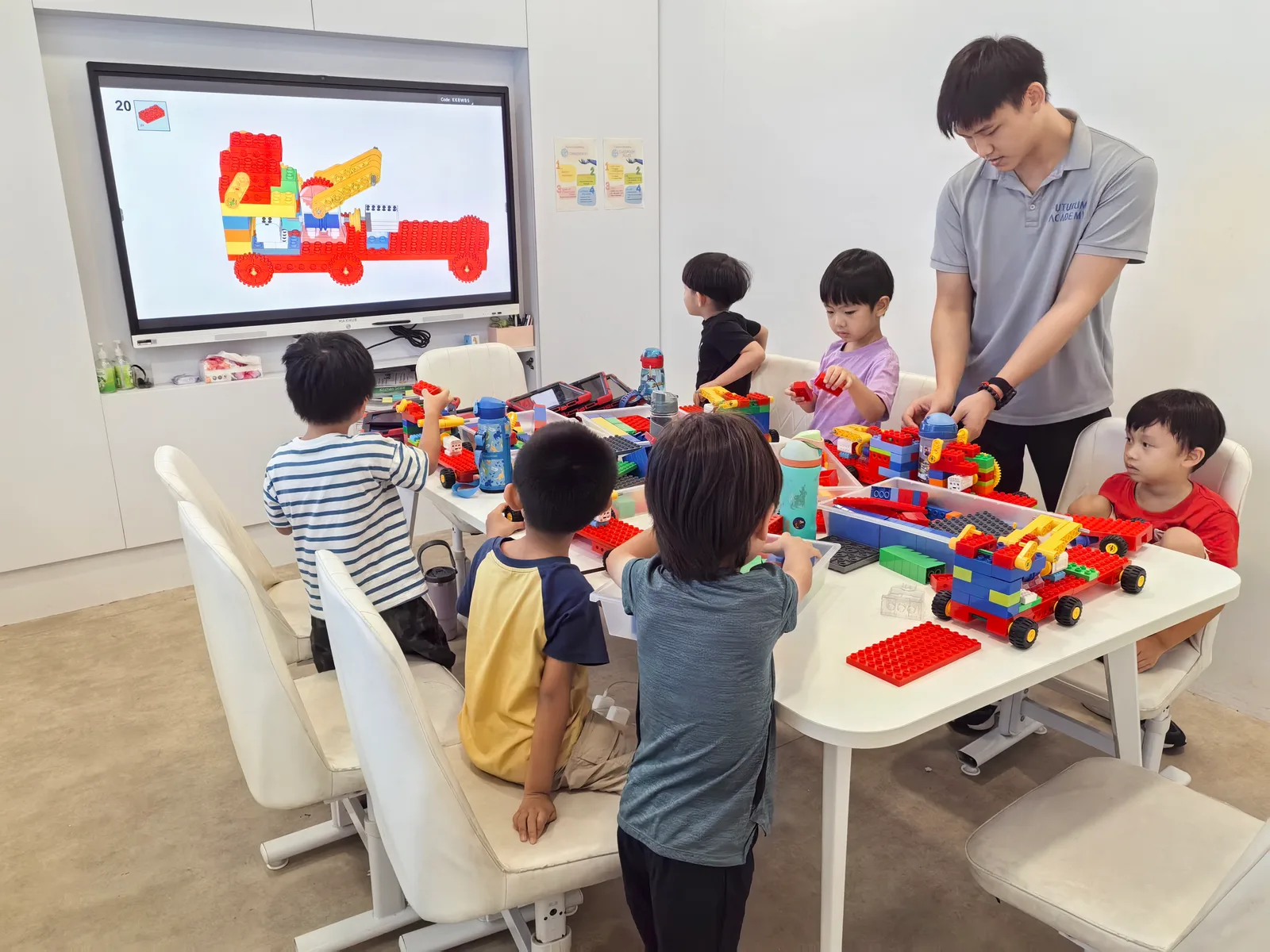 Futurum Academy foundations students building robots with large bricks